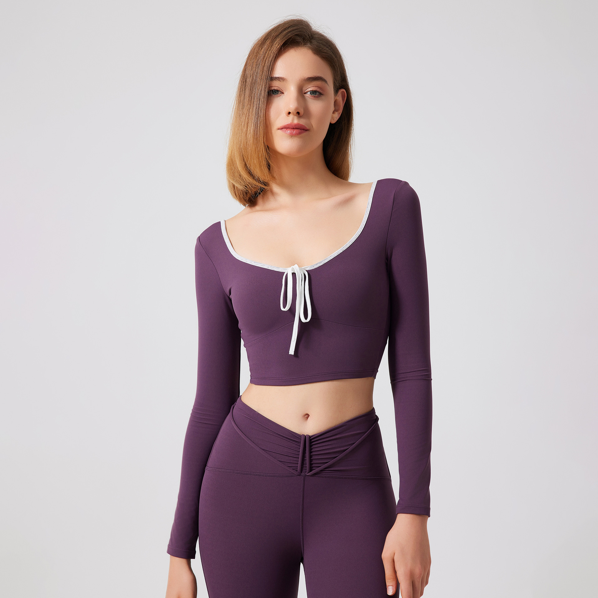 34. Women's sports yoga suit with padded bra and color-blocked mesh for running;