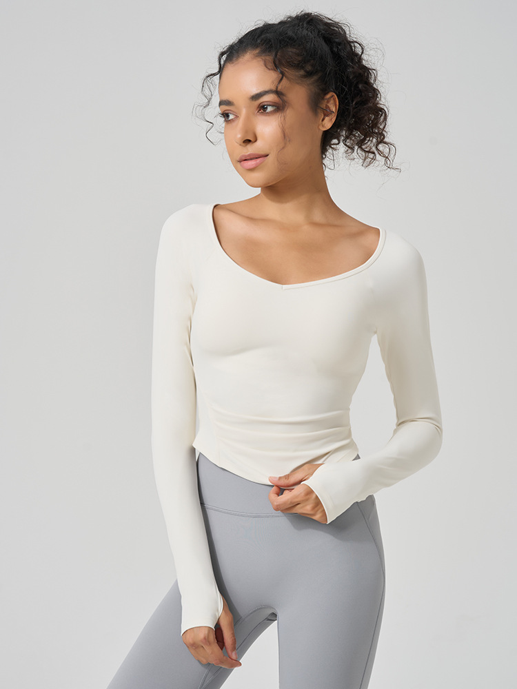 62. Close-fitting, elastic, and stretchy pullover yoga suit with ruffles, long sleeves, and a bare-skin feel