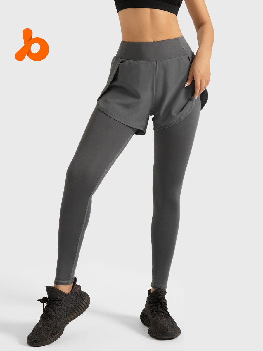 63. High-waisted yoga pants with faux two-piece pockets, designed to lift the hips and provide a slimming effect.
