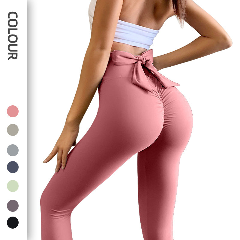 25. High-waisted peach-shaped hip-hugging fitness pants with a bow tie.