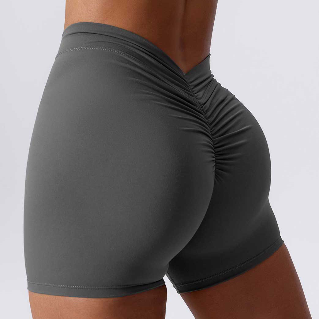 96. Deep V-neck, ruched, tight-fitting yoga shorts with a perky butt.